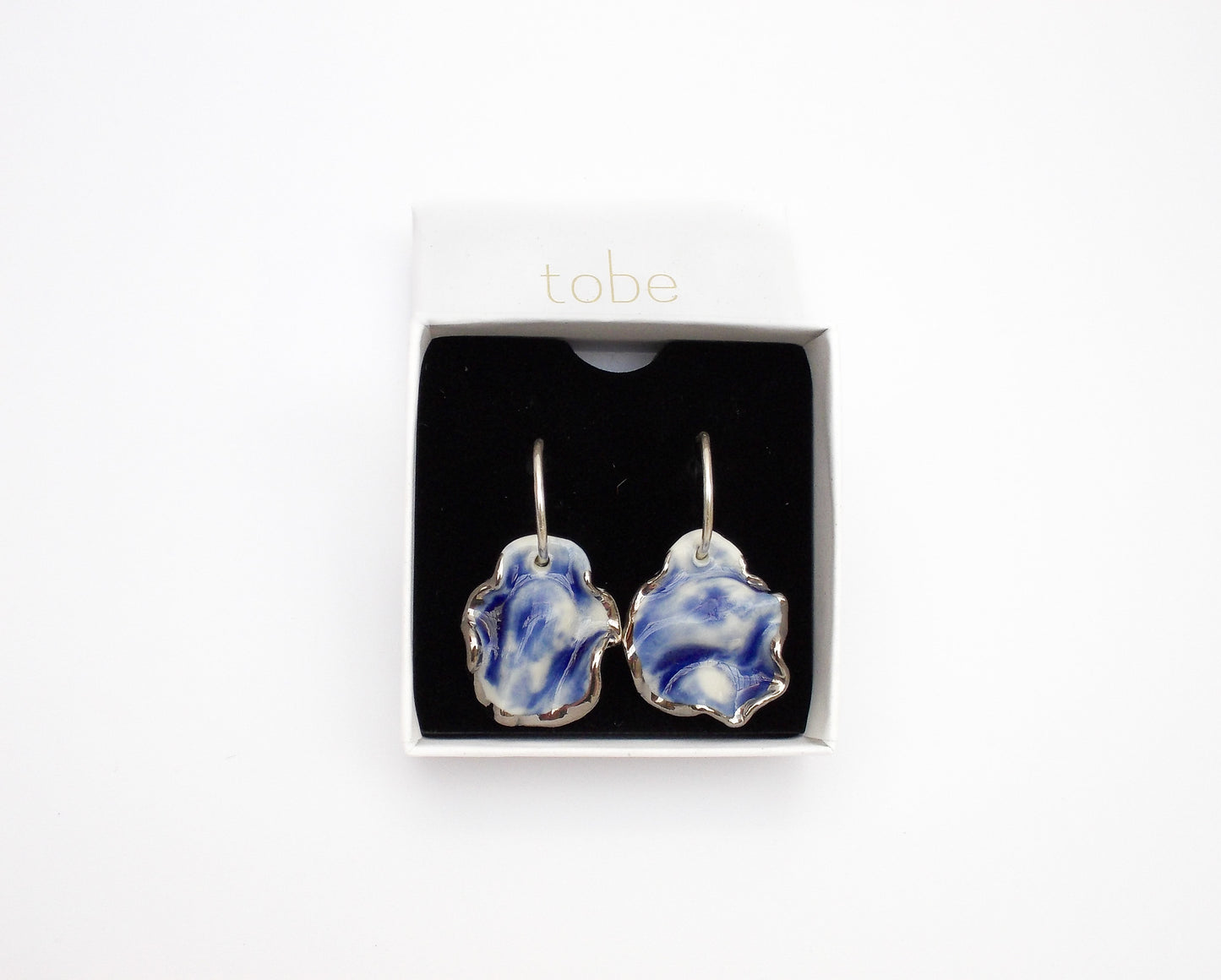 resilience hoop porcelain earrings